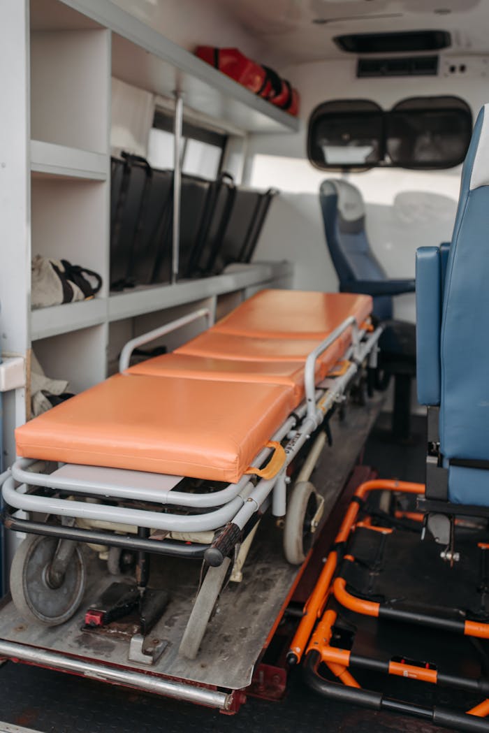Detailed view inside an ambulance showing stretcher and medical equipment storage.